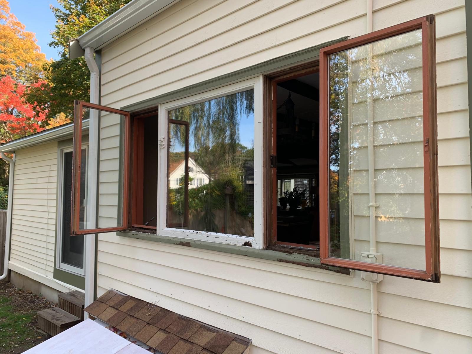 Residential window replacement, before and after — Before