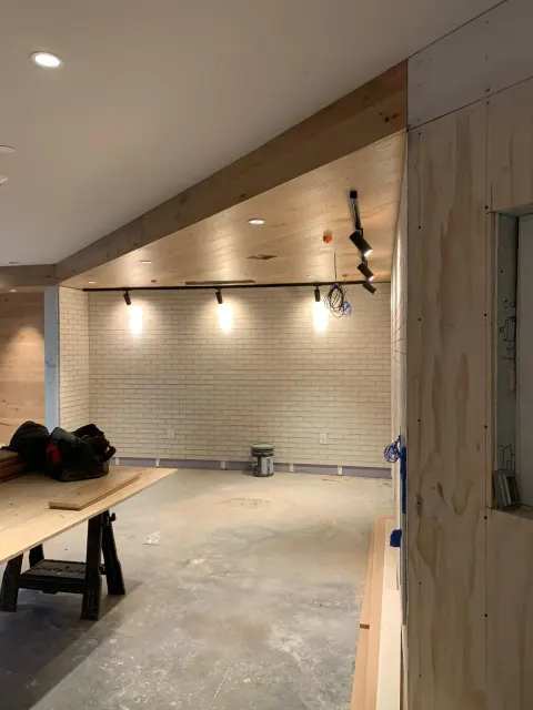 Brick feature wall and wood ceiling in progress