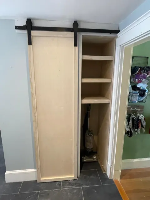 Built-in storage with sliding door in progress